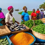 Home 21 감비아와 서아프리카 음식 비교 - A vibrant Gambian seafood market scene at the Atlantic coast during early morning, featuring fresh f...